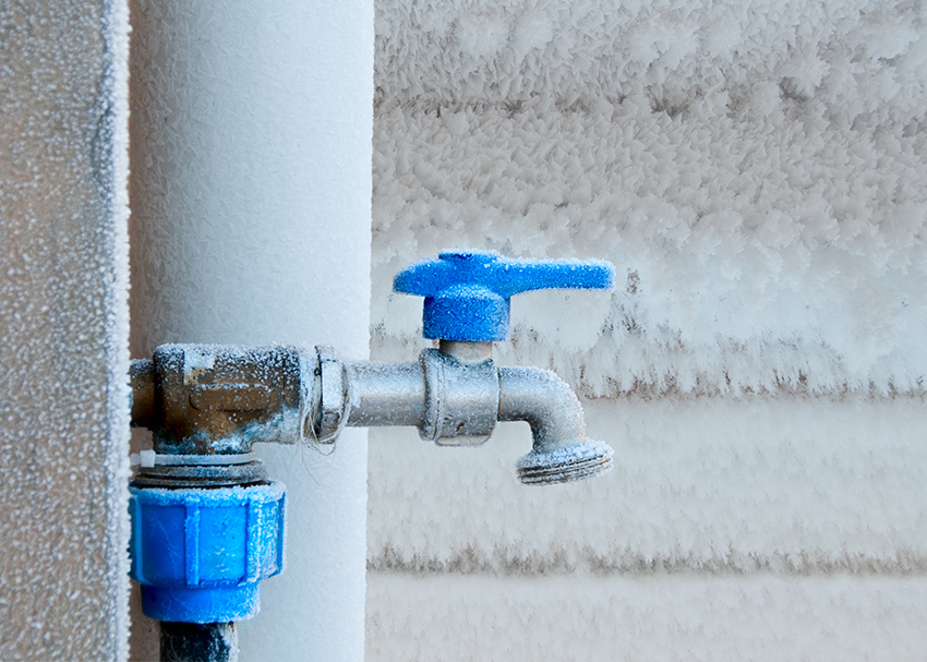 Frozen faucet in winter